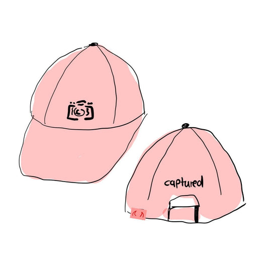 cap.tured red